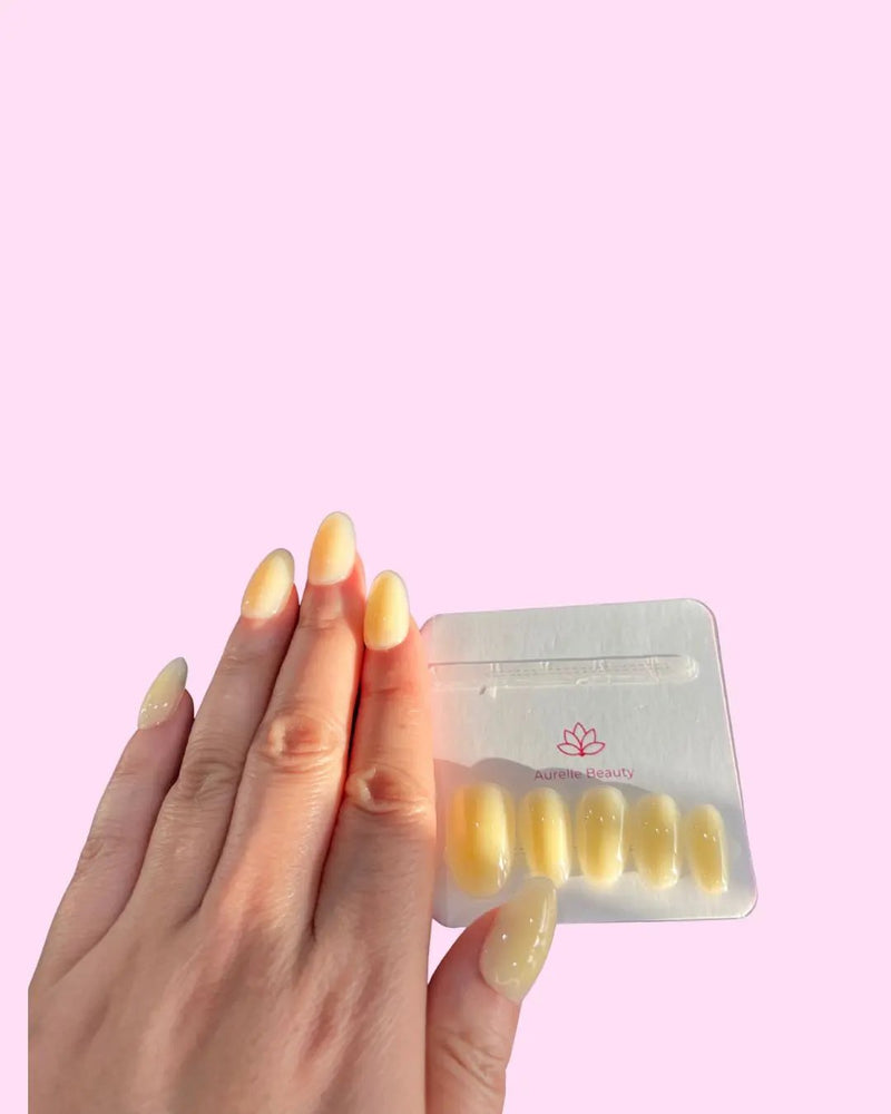 Butter Yellow BIAB Press-On Nails on hand with pack