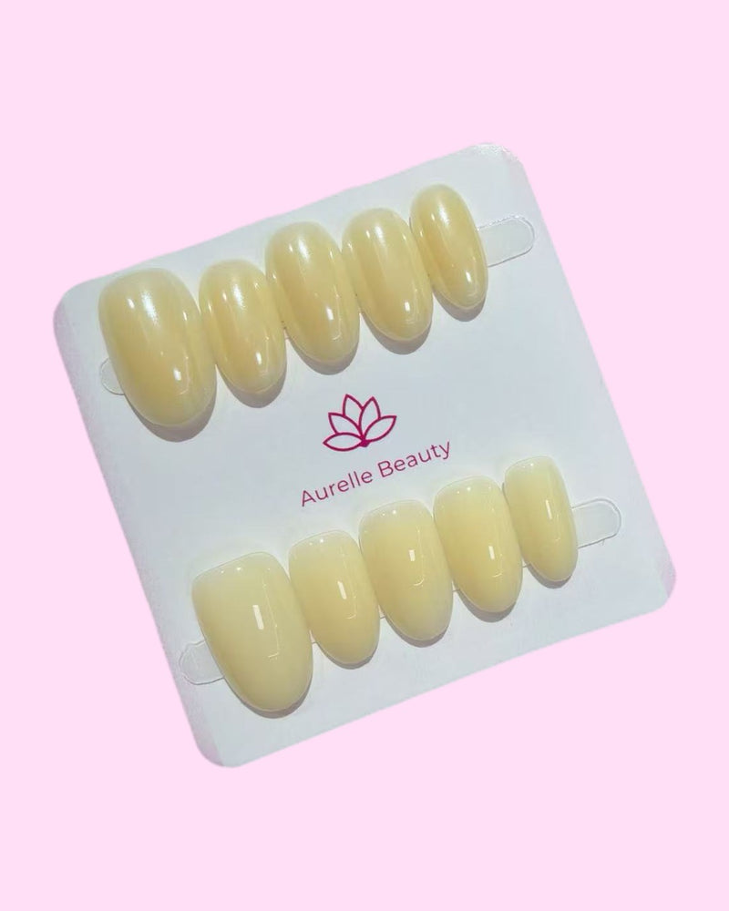 Yellow BIAB press on nails set of 10 on Aurelle Beauty card